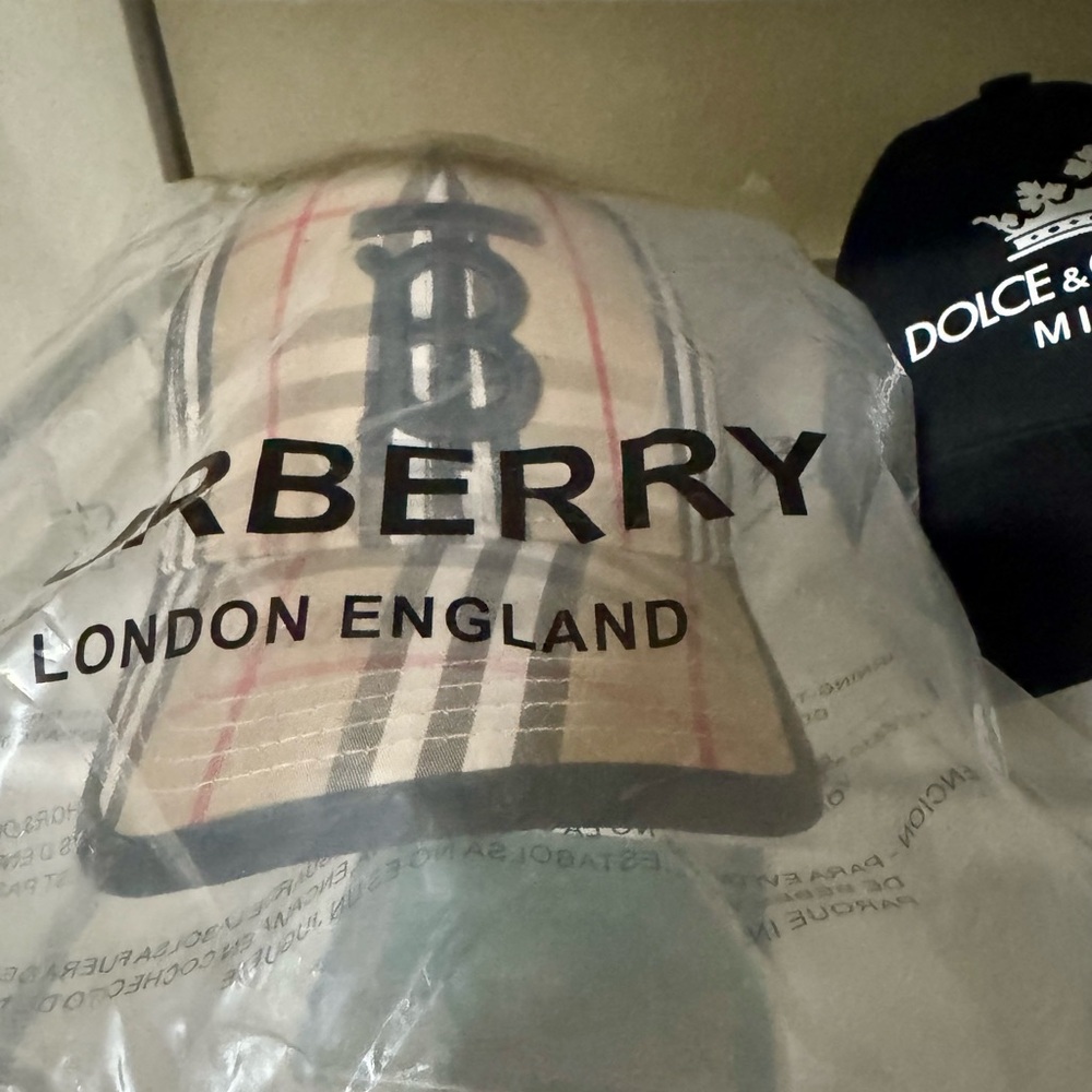 Burberry plaid snap back hat.
